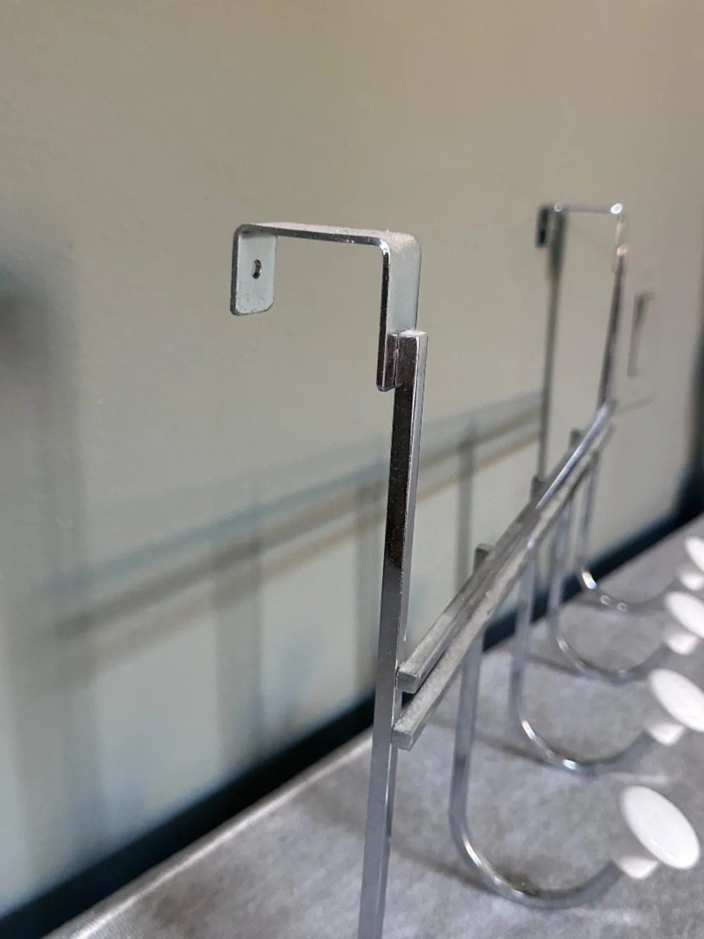 Container Store: Chrome 5-Hook Over-the-Door Rack with White Ceramic Knobs
